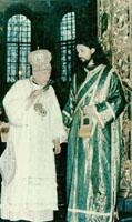 Patriarch Mstislav gives Protodiakon Oleg (now Metropolitan Moisey) a cross.  