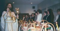 Fr. Oleg consecrates the Easter cakes and Easter eggs, brought by faithful on Easter